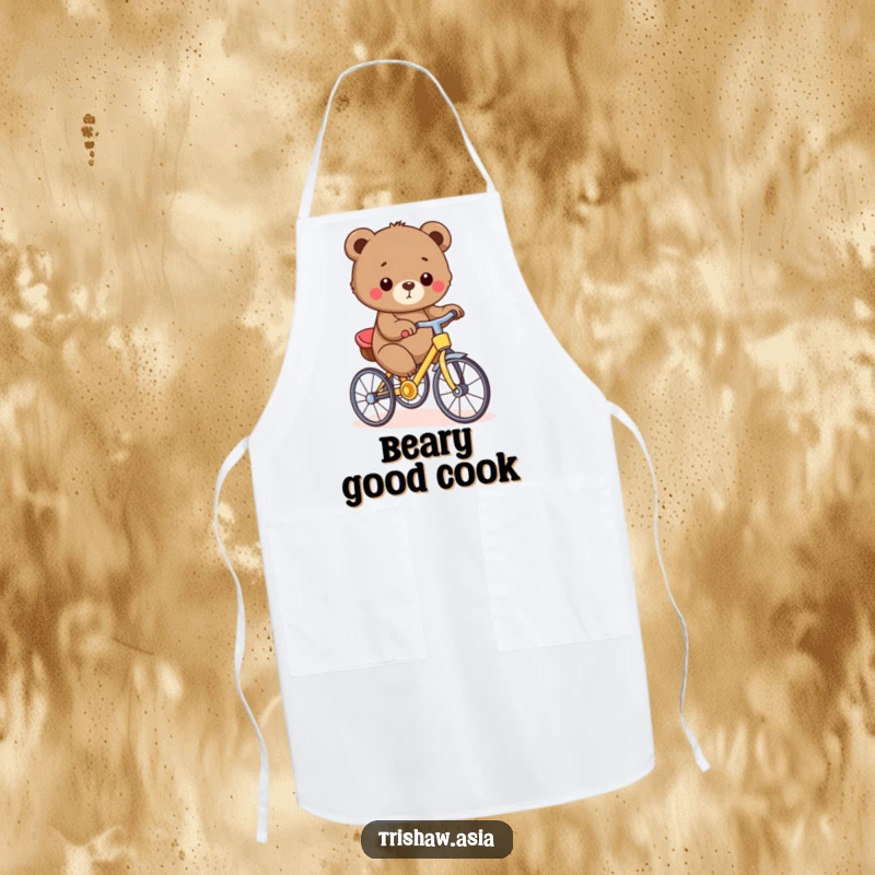 Funny Apron showing a small, round bear cub proudly pedaling a tiny, colorful trishaw, ready for kitchen duty with a smile.
